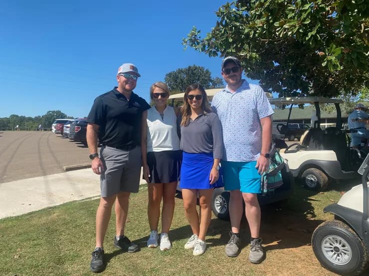 Team golf outing foursome at a charity event