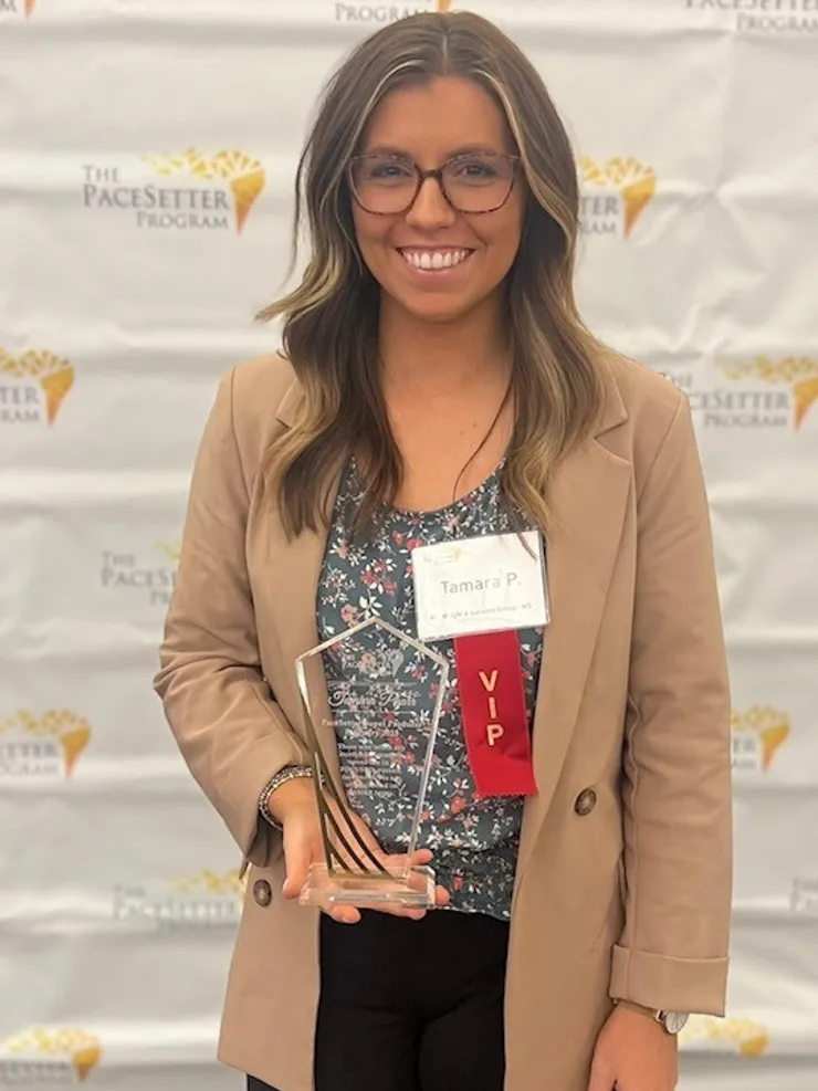Tamara Pharr receiving an award at The PaceSetter Program