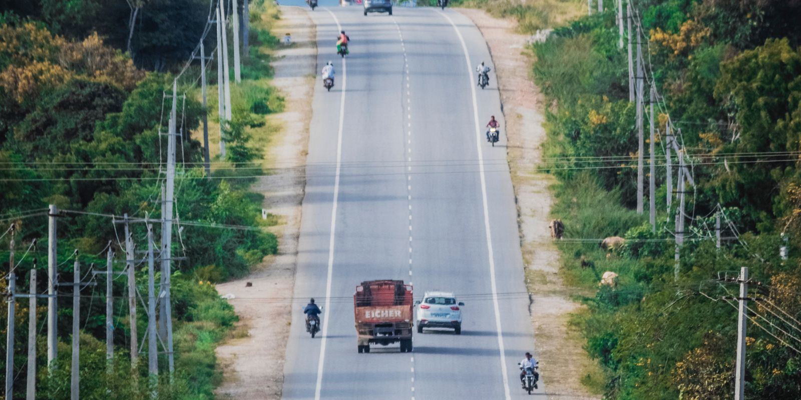 Cars traveling a two-lane rural highway