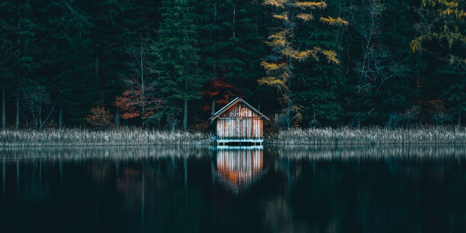 A lakeside cabin porch at golden hour