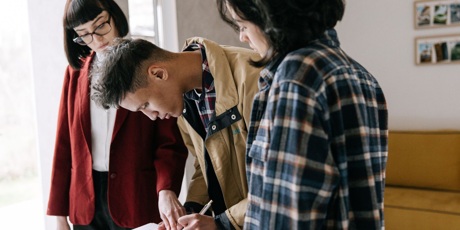 A homeowner reviewing mortgage and escrow paperwork