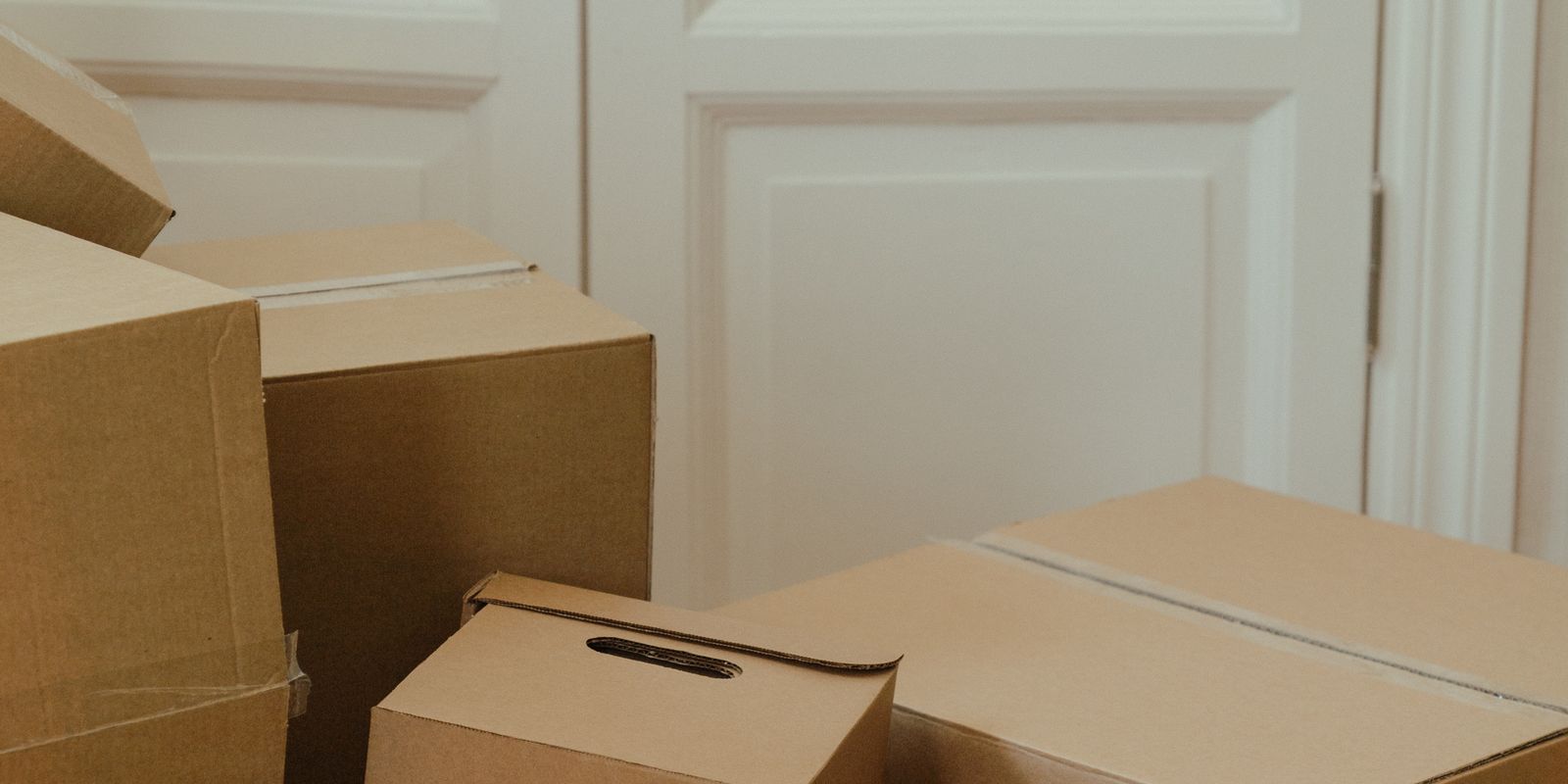 Moving boxes stacked in an empty apartment
